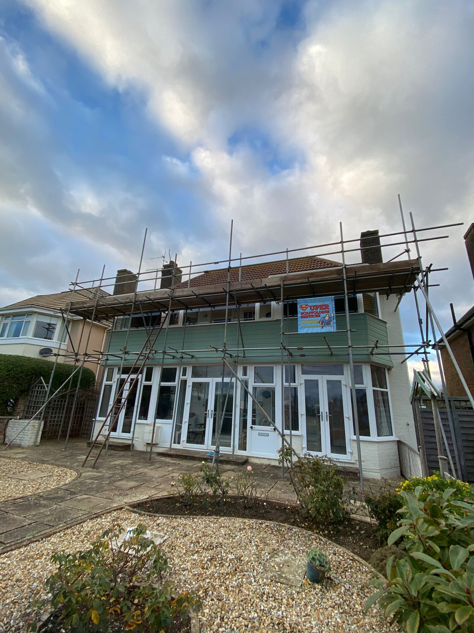 Front scaffold on a 1930s house with a gravel garden